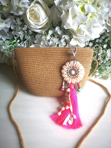 Straw bag with charm